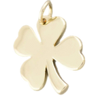 A polished yellow gold four-leaf clover charm pendant with a small top loop, shown on a plain white background.