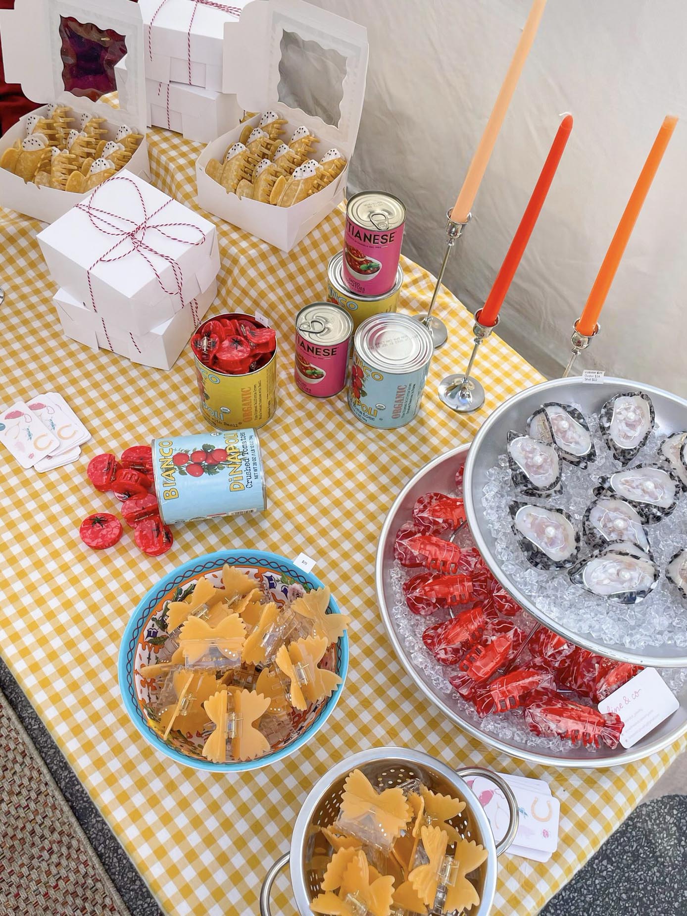 Table with various snacks and drinks on a yellow checkered tablecloth